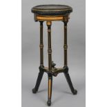 A 19th century ebonised and amboyna jardiniere stand
The circular top with gilt brass beading above