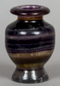 A turned fluorite vase
Of baluster form.  14.5 cm high.