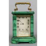 A late 19th century miniature malachite cased carriage clock
The engraved silvered dial with Roman