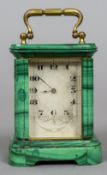 A late 19th century miniature malachite cased carriage clock
The engraved silvered dial with Roman