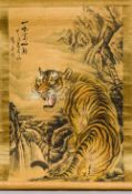 A Chinese painted scroll
Worked with a tiger in a mountainous landscape,