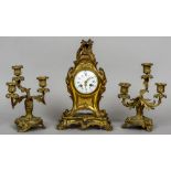 A 19th century three piece gilt bronze clock garniture
Decorated in the rococo manner.