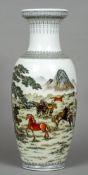 A Chinese porcelain vase
Decorated with wild horses in a landscape opposing calligraphic script,