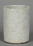 A Chinese porcelain brush pot
With all over crackle glaze.  14.5 cm high.