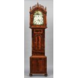 A 19th century mahogany cased eight day longcase clock
The painted arched dial with Roman numerals,