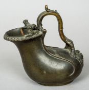 A late 18th/early 19th century Grand Tour patinated bronze ewer
With scrolling loop handle and twin