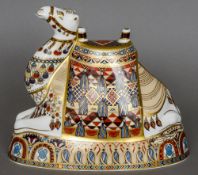A Royal Crown Derby bone china paperweight modelled as a recumbent camel Decorated in the Imari