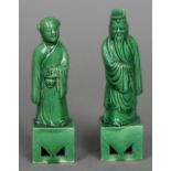 A pair of Chinese porcelain figures of a sage and his companion Both with allover green glaze. 15.