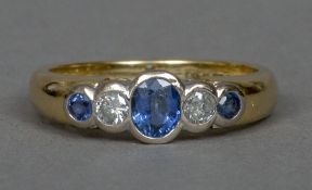 An 18 ct gold five stone sapphire and diamond ring The three sapphires interspersed with two