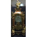 A large boulle bracket clock With bracket, the domed top surmounted a female warrior,