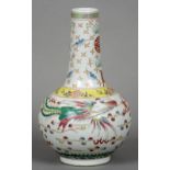 A Chinese porcelain vase Decorated with a phoenix and dragon interspersed with stylised clouds,