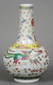 A Chinese porcelain vase Decorated with a phoenix and dragon interspersed with stylised clouds,