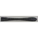 A tribal lime spatula, possibly Trobrian Islands With scrolling carved decoration. 55 cm long.