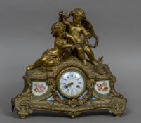 A 19th century Sevres type porcelain panel mounted ormolu mantel clock The top with putto and a