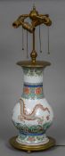 A 19th century Chinese porcelain vase Decorated in the round with a dragon chasing a flaming pearl,