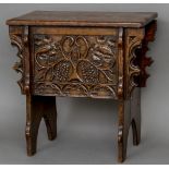 A late 19th/early 20th century carved oak boarded box stool With rectangular hinged lid above a