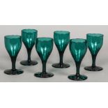 A set of six 19th century green tinted wine glasses 13.5 cm high.