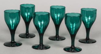 A set of six 19th century green tinted wine glasses 13.5 cm high.