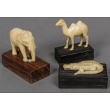 Three small carved ivory models of animals, possibly Indian An elephant, a camel and a crocodile,