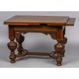 An 18th century Dutch oak drawer leaf table The cleated rectangular top above the carved frieze,