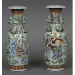 A pair of 19th century Cantonese porcelain vases Each decorated with various figures in interiors