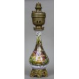 A 19th century gilt bronze and brass mounted porcelain oil lamp The main body painted with a