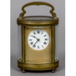 An early 20th century brass cased carriage clock Of oval form,
