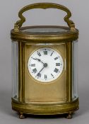 An early 20th century brass cased carriage clock Of oval form,