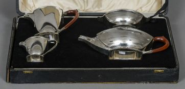 A boxed George VI Art Deco style silver four piece tea set, hallmarked Birmingham 1950,