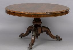 A 19th century rosewood tilt-top breakfast table The moulded circular top above the bulbous