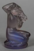 A Lalique amethyst glass model of a nude woman Together with a Lalique green glass model of a