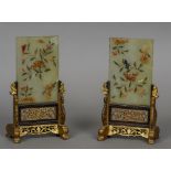 A pair of Chinese hardstone mounted jade table screens Each with floral decorations mounted in gilt