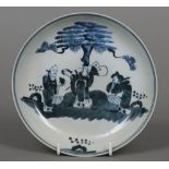 A 19th century Chinese blue and white dish Decorated with various courtly figures in a walled