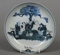 A 19th century Chinese blue and white dish Decorated with various courtly figures in a walled