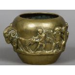 A 19th century Grand Tour brass jardiniere Decorated in the round with putto and cherubs and