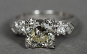 A platinum and diamond three stone ring The central claw set stone spreading to just over 2 carats,