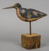 A painted carved wooden wading bird decoy, possibly a woodcock Of naturalistic form,
