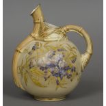 Two Royal Worcester blush ivory jugs Each with floral decoration. The largest 33 cm high.