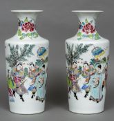 A pair of Chinese porcelain vases Each decorated with a dignitary and attendants. Each 42 cm high.