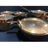 Four antique copper saucepans and covers Together with a copper preserve pan and cover.