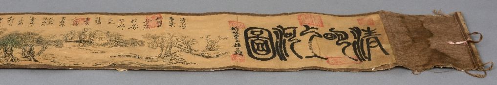 A Chinese scroll Decorated with figures and animals amongst a landscape and with various