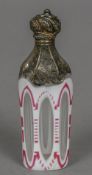 A 19th century white metal mounted cameo glass scent bottle The faceted body cased in white and red.