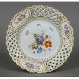 A Meissen porcelain plate Decorated with insects amongst floral sprays and with gilt heightening.