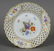 A Meissen porcelain plate Decorated with insects amongst floral sprays and with gilt heightening.