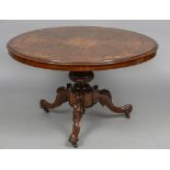 A marquetry inlaid Victorian burr walnut tilt-top breakfast table The florally inlaid circular top