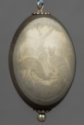 An unmarked white metal mounted emu egg Carved with a vignette of an emu and a kangaroo. 16.