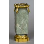 A Chinese carved pale green jade kong vase, possibly Ming Each side worked with a floral spray,