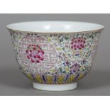 A Chinese famille rose porcelain bowl Of flared cylindrical form, decorated with floral scrollwork,