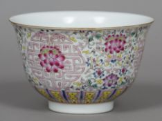 A Chinese famille rose porcelain bowl Of flared cylindrical form, decorated with floral scrollwork,