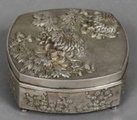 A Chinese repousse decorated silver box The removable lid decorated with floral sprays,